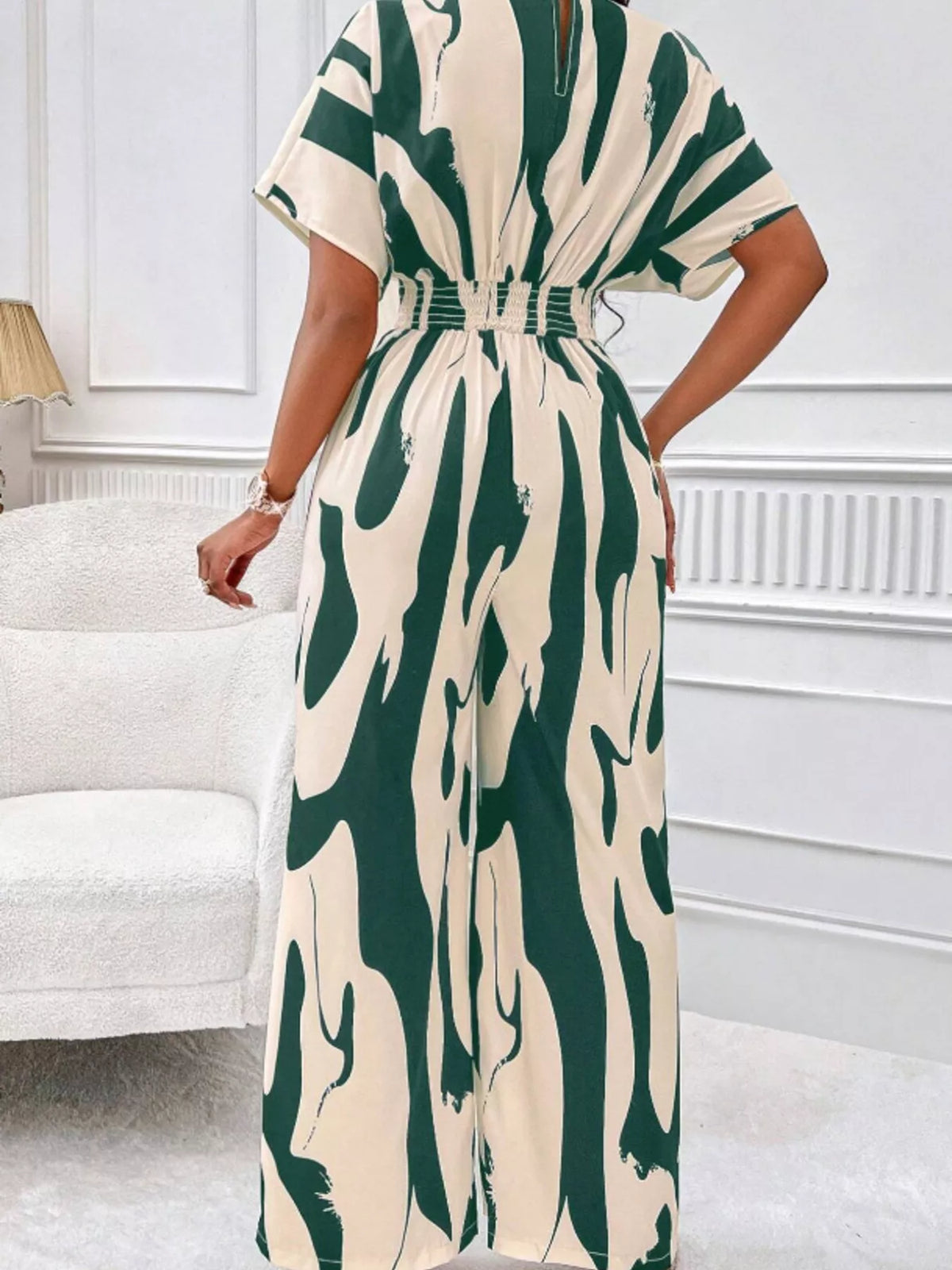 Abstract print wide leg jumpsuit with ruched bodice close up view