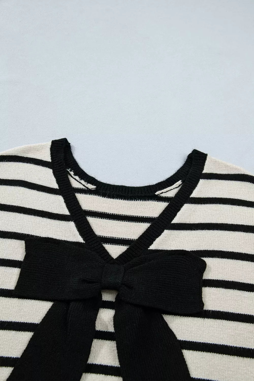Feminine black bow sweater full look