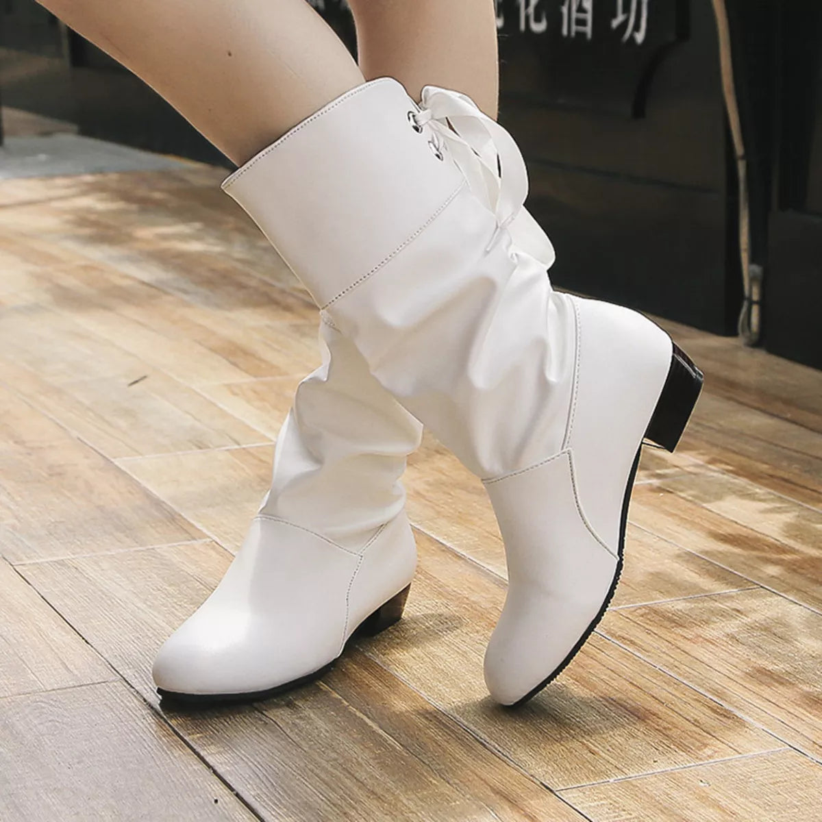 Round toe block heel boots angled pair