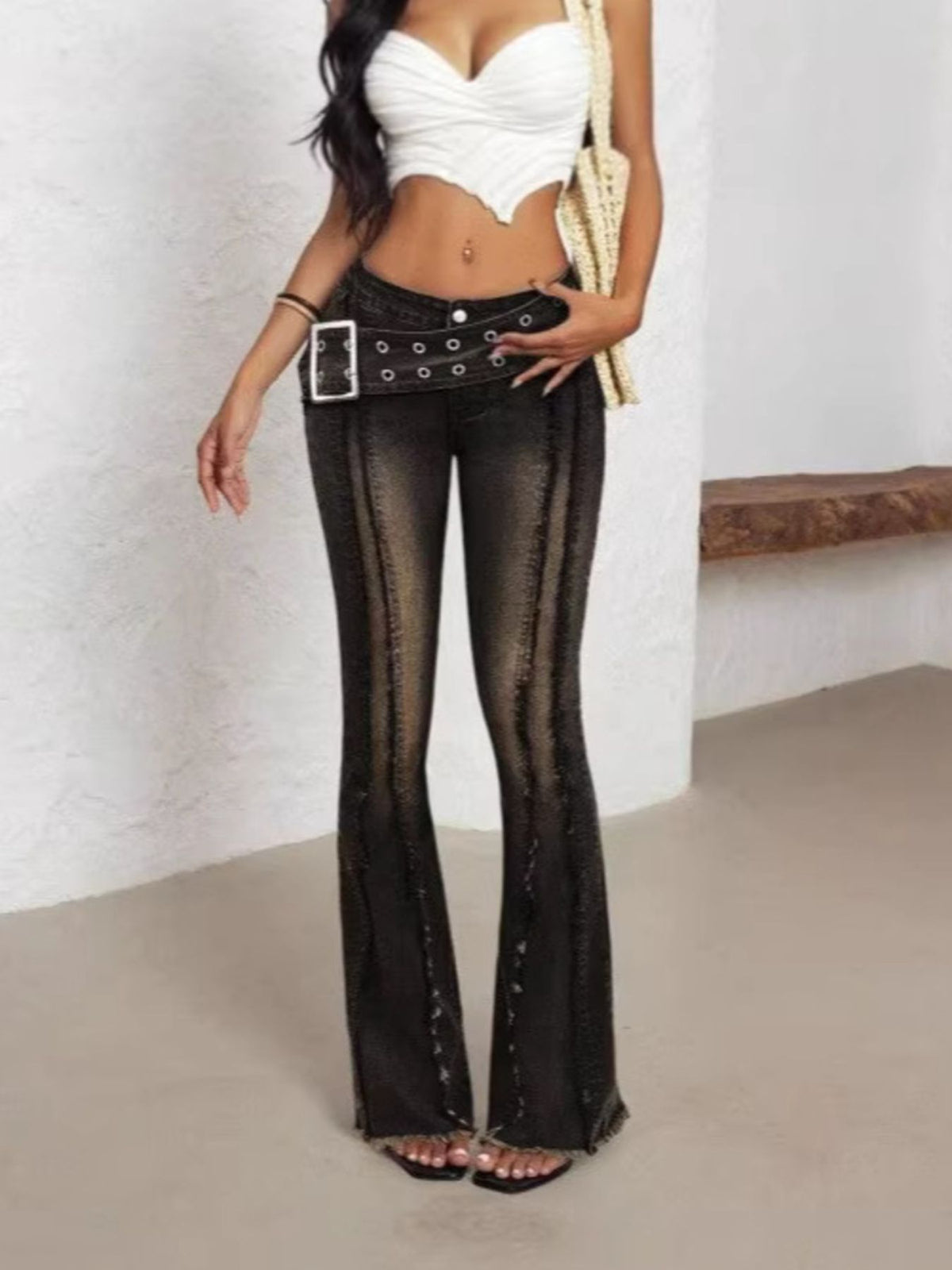 Black flare jeans side profile showing leg shape