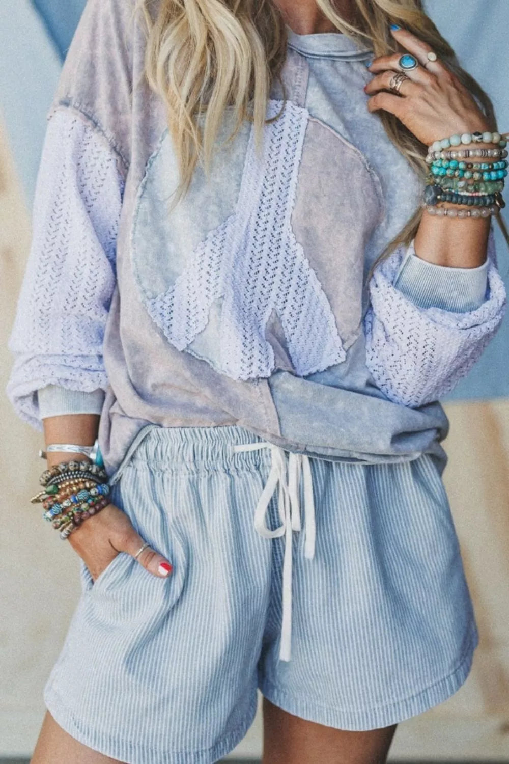 Light blue striped drawstring shorts side view