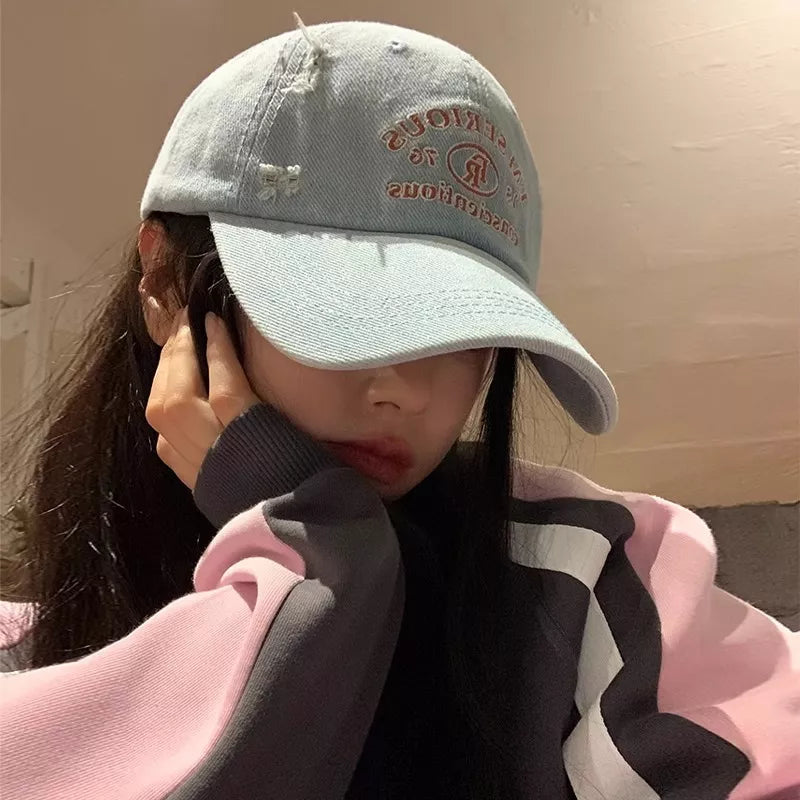 Distressed baseball cap shown from the side