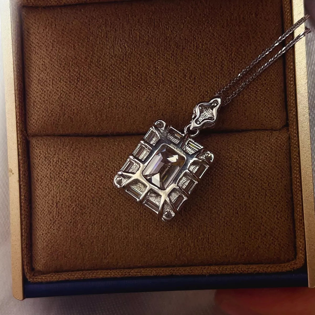 Close up of the moissanite pendant stone and setting