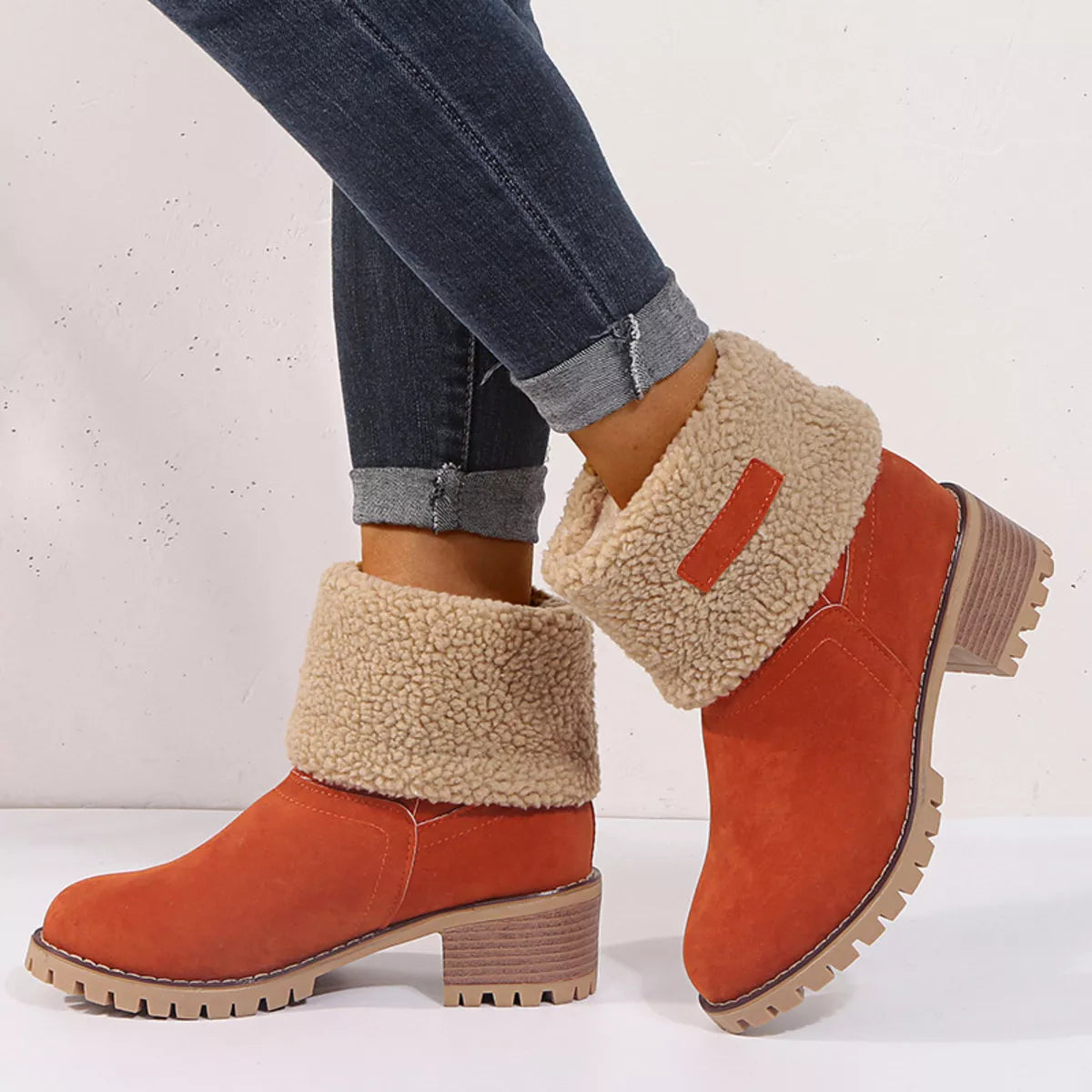 Suede round toe block heel boots studio flat lay
