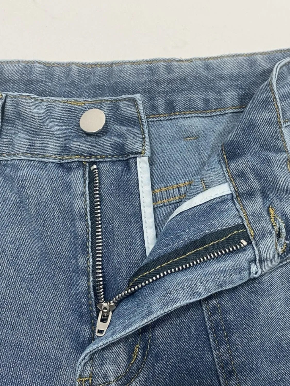 Distressed jeans pocket detail
