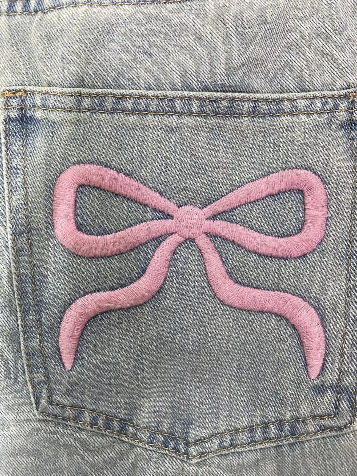 Light wash wide leg jeans styled full length view