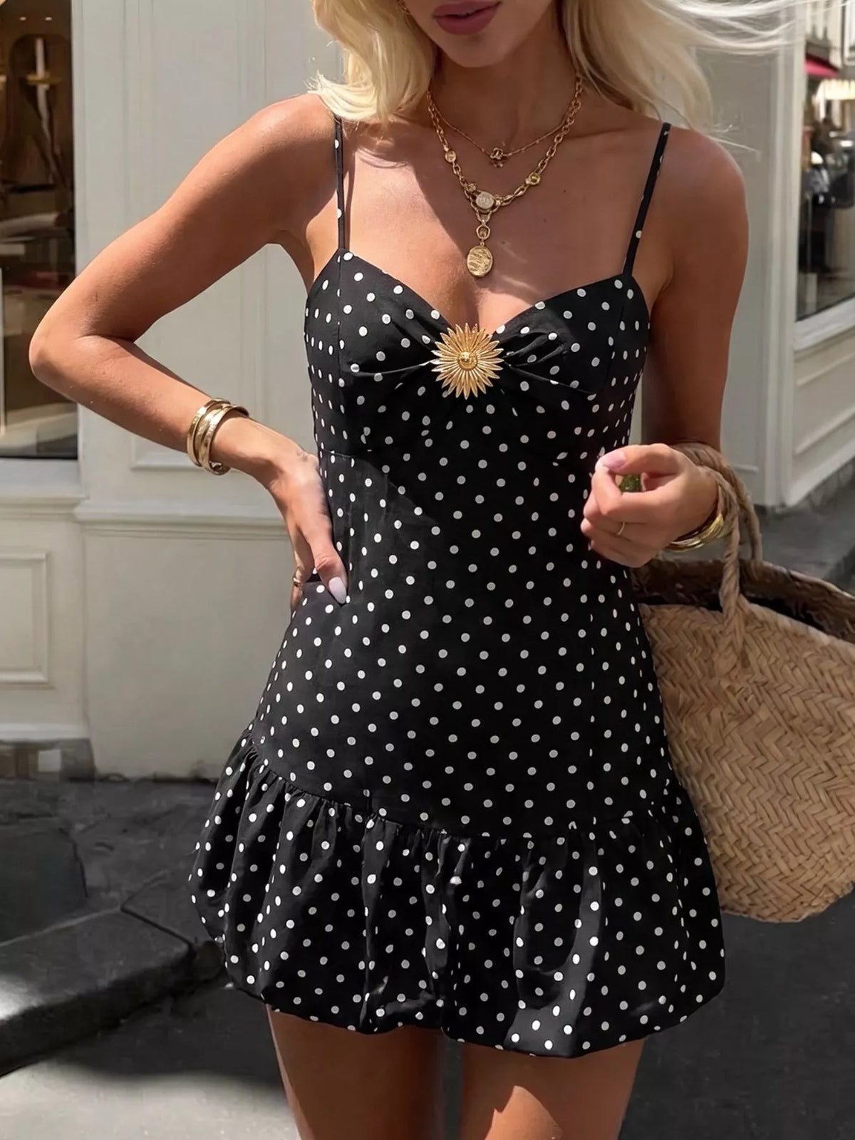 Black polka dot spaghetti strap ruffle hem dress front view