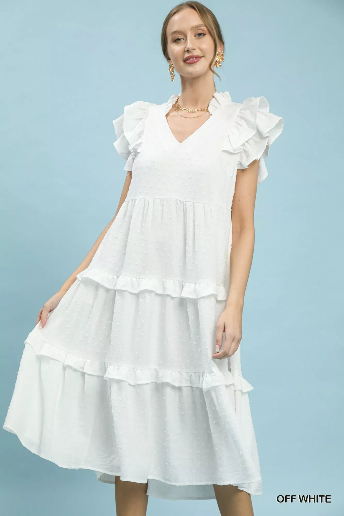 Off white textured tiered midi dress with ruffle sleeves worn by a model