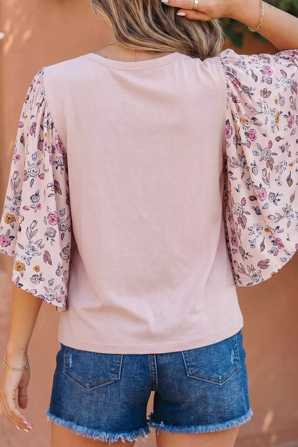 Dusty pink bell sleeve blouse side view