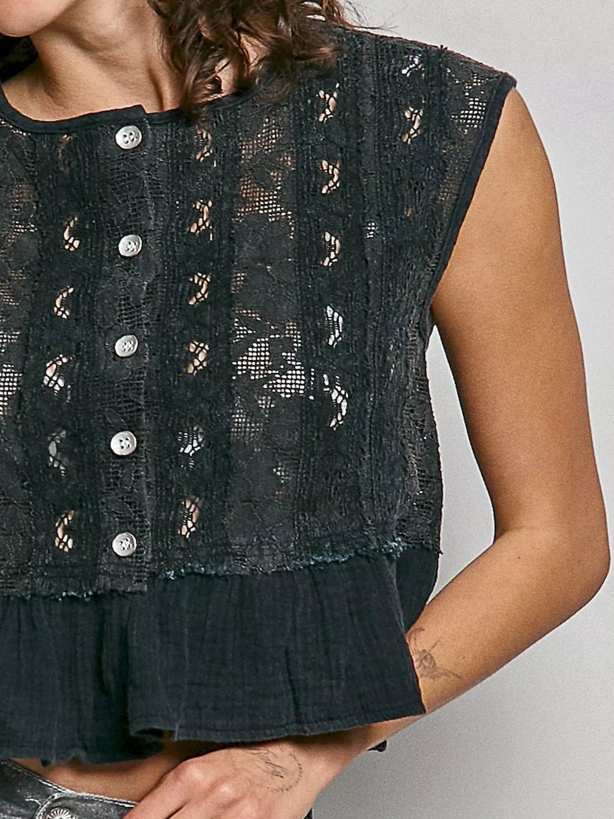 Black lace top styled with high rise jeans