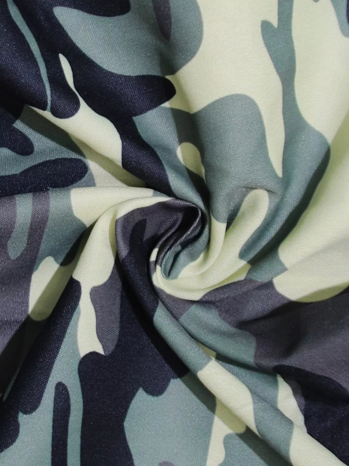Pocket and seam detail on the camo romper