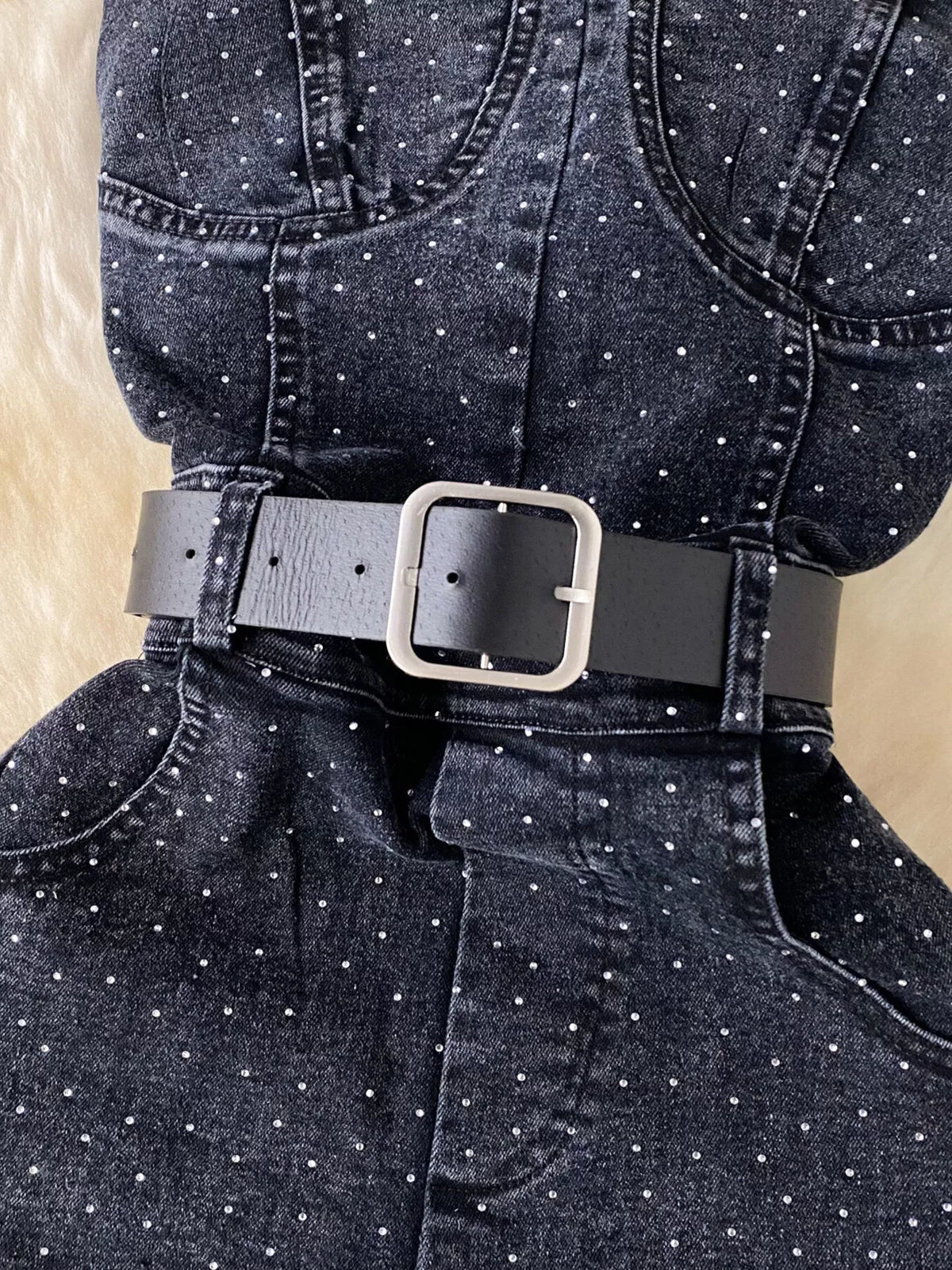Blue strapless denim romper with diamante detail back view