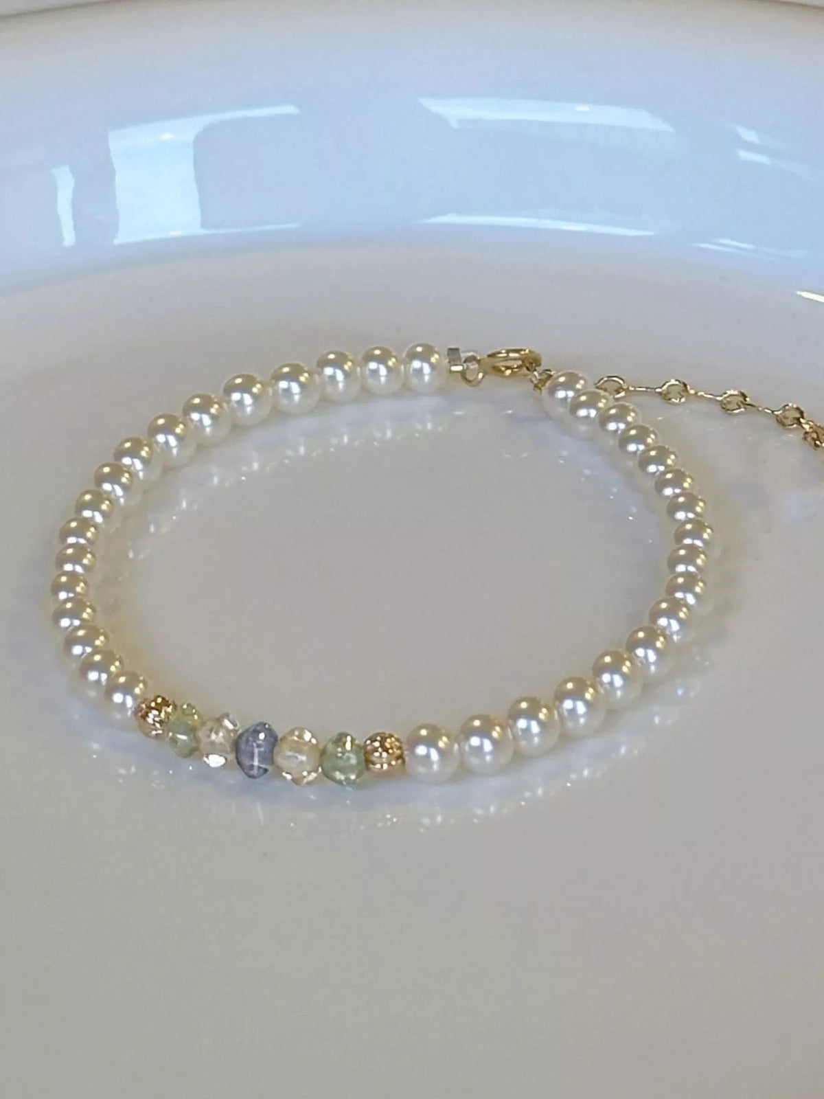 Gold plated pearl bracelet angled view