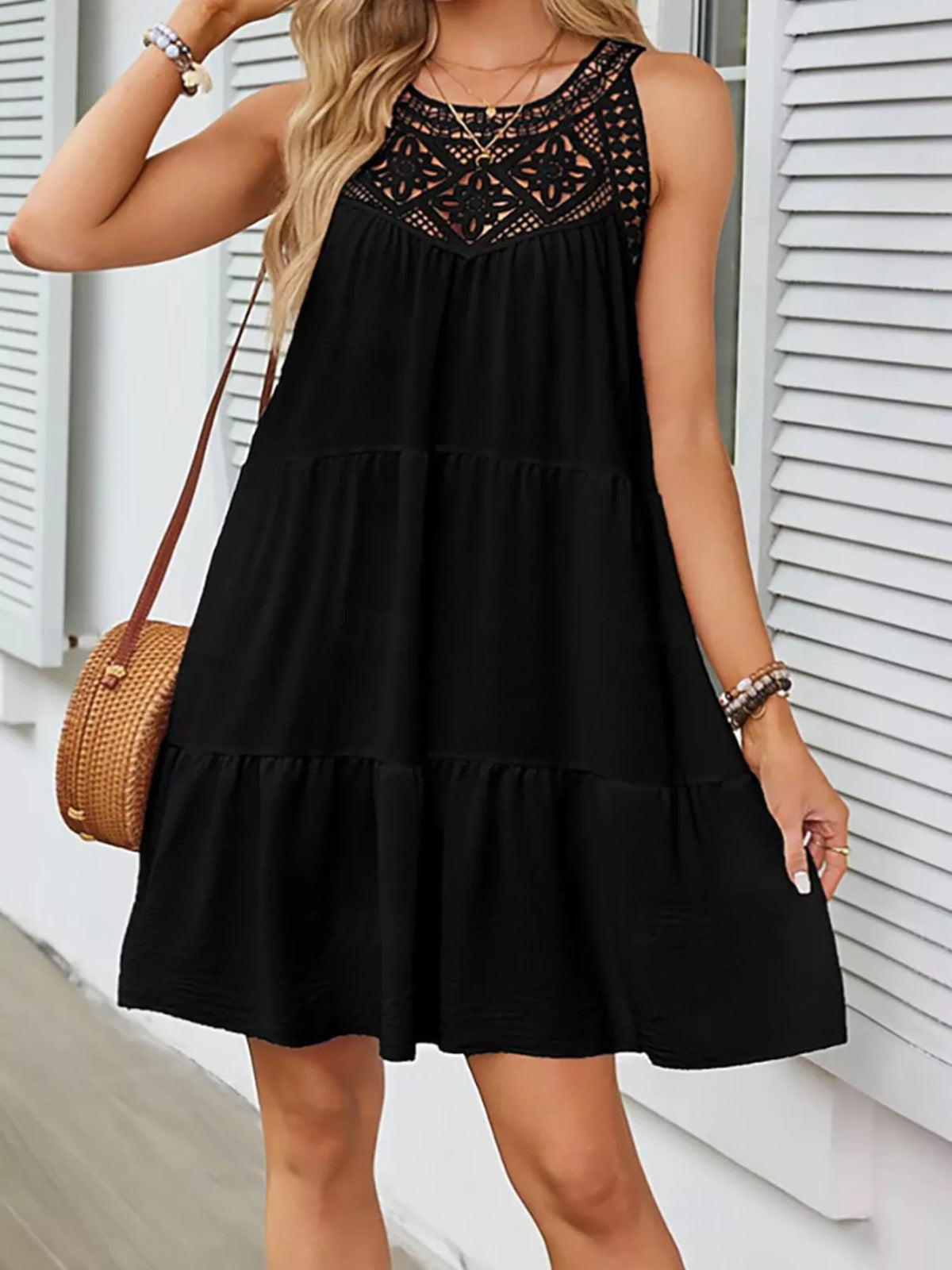 Sleeveless tiered dress shown in black