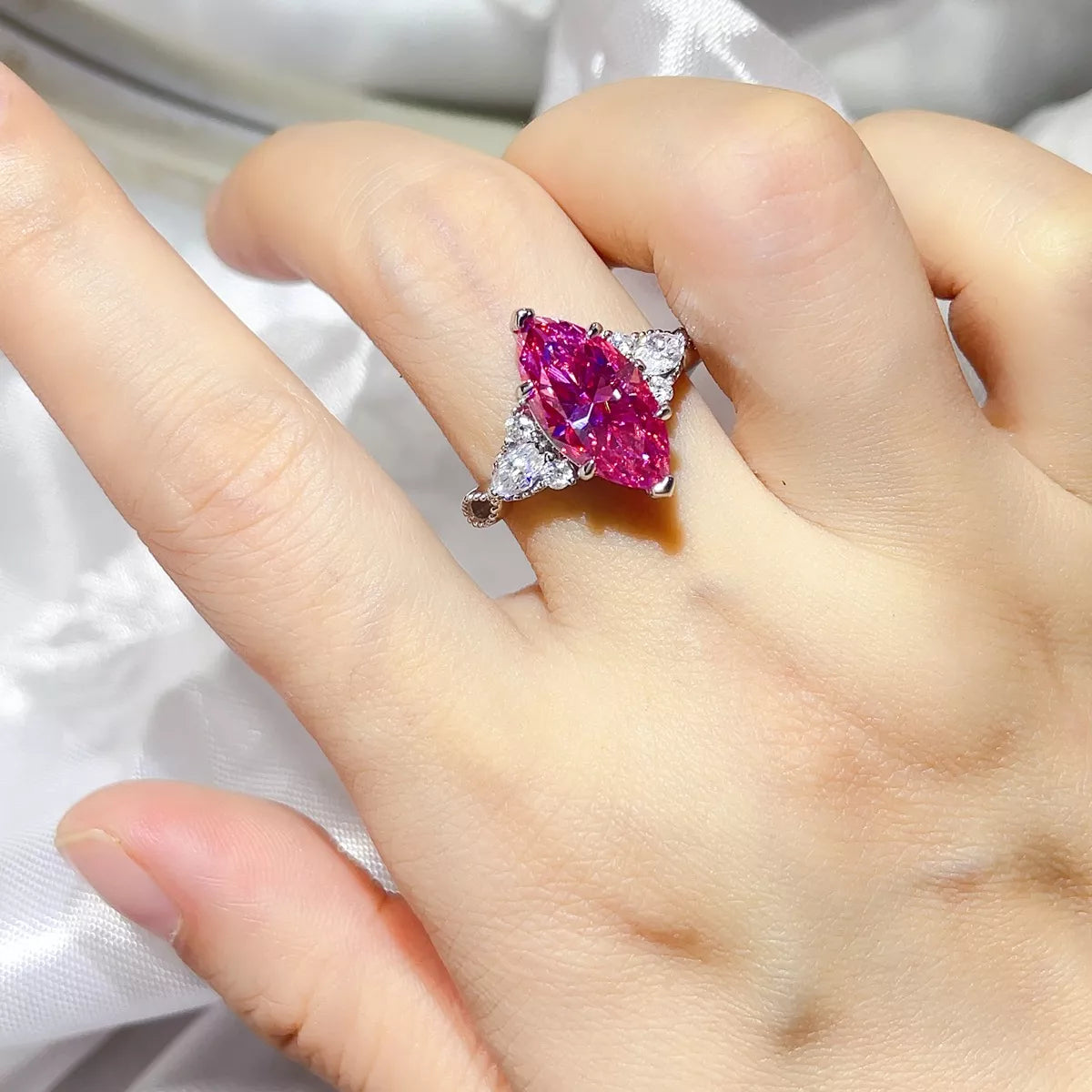 Close up of pink moissanite stone catching light