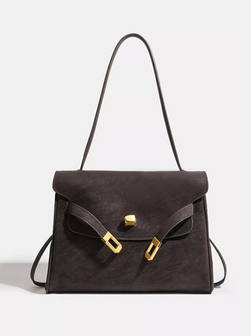 Buckle closure leather shoulder bag front view