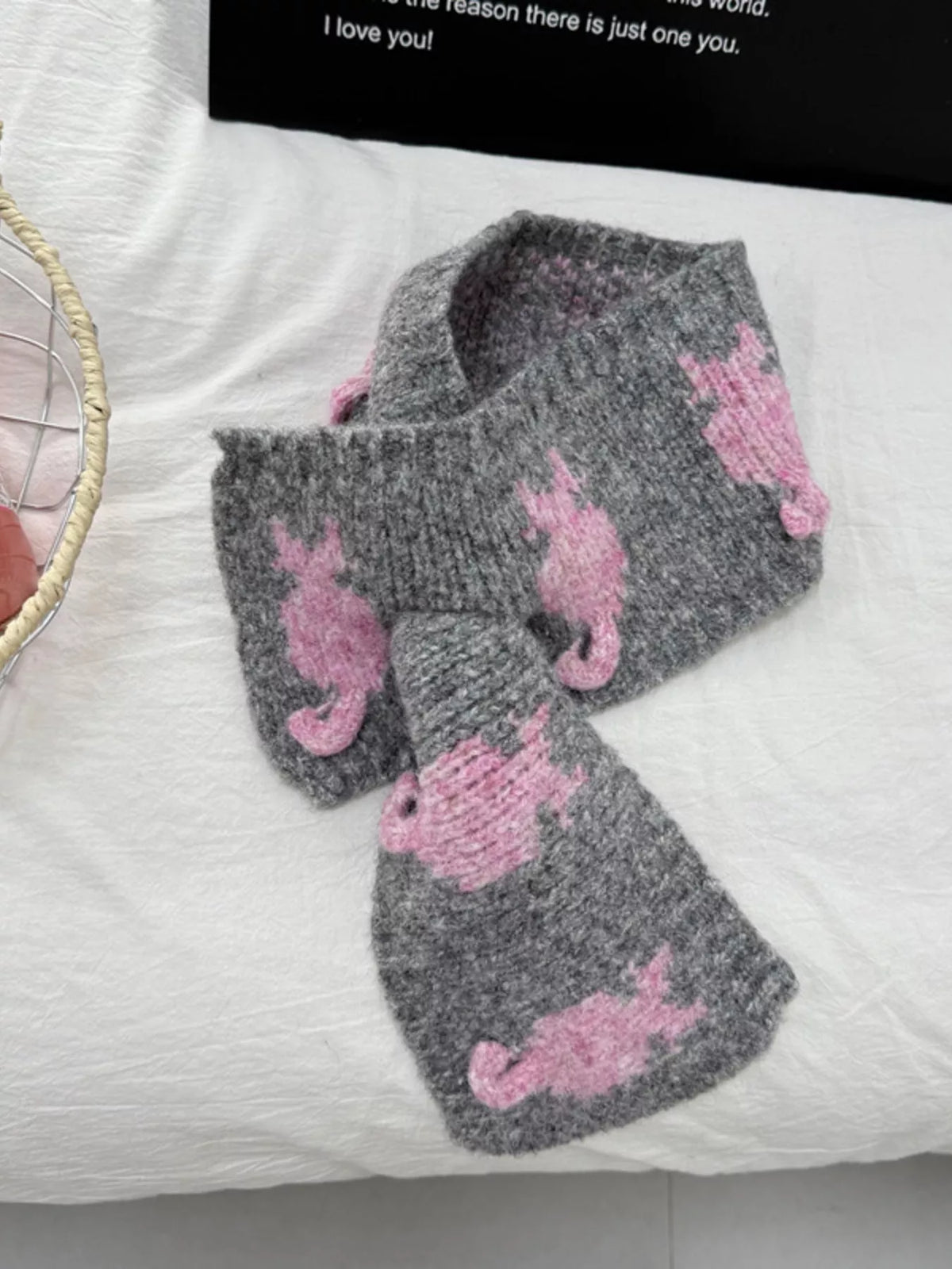 Dark gray knit scarf around the neck
