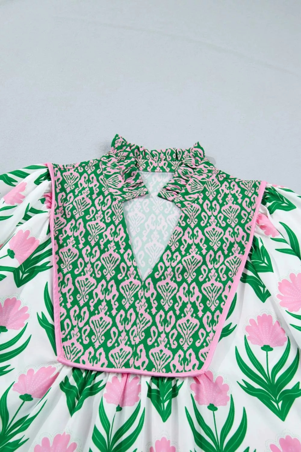 Sage floral puff sleeve V neck blouse, on model