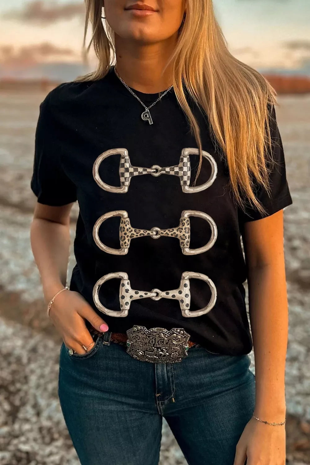 Black western tee with horse bit print shown from the front