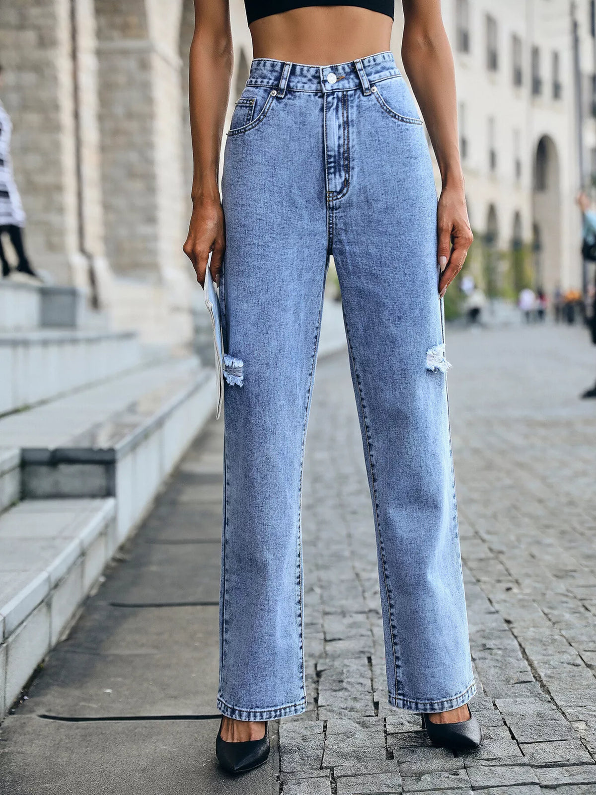 Back view of distressed high waist jeans