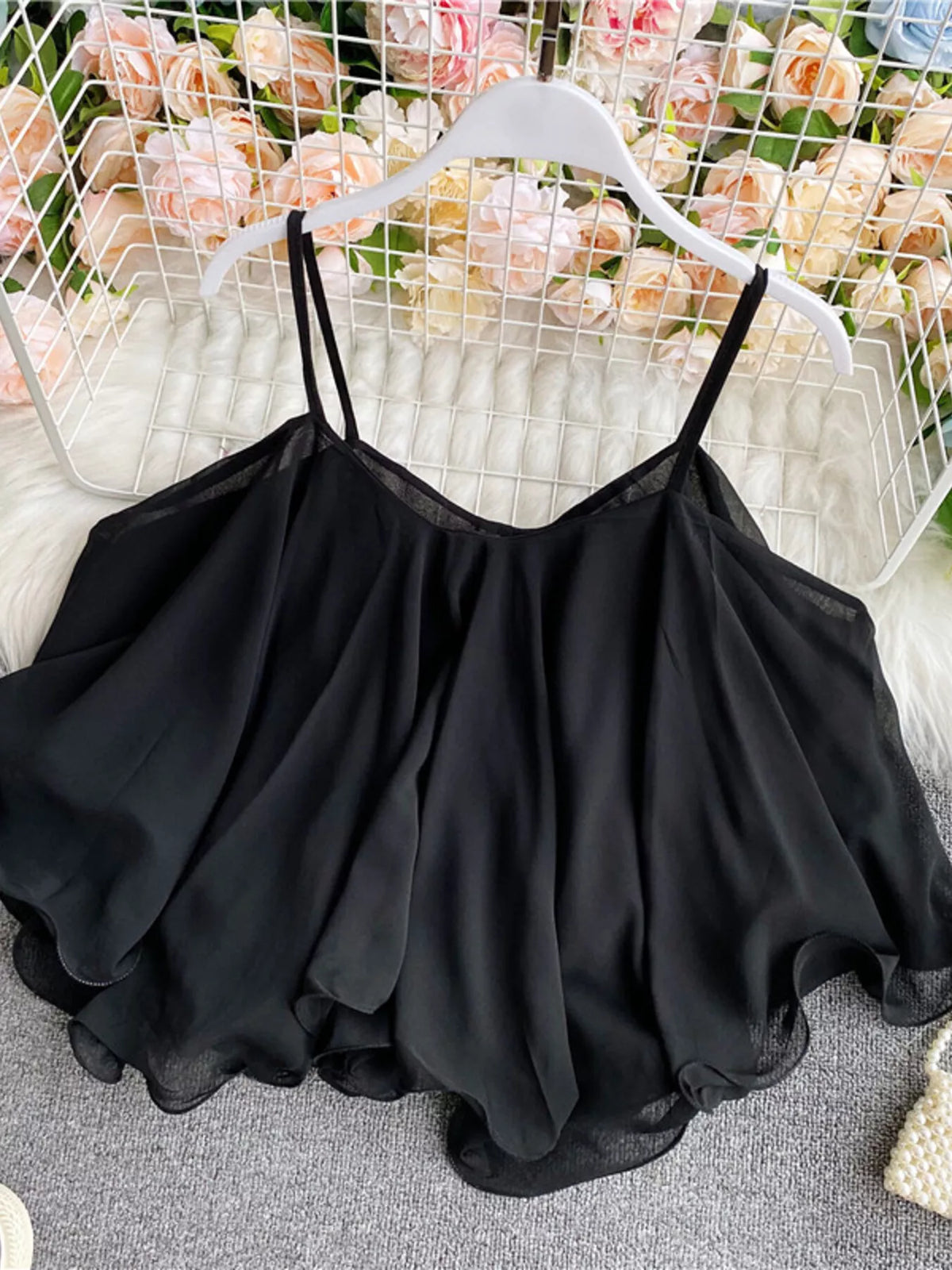 Ruffled flowy cami top side view