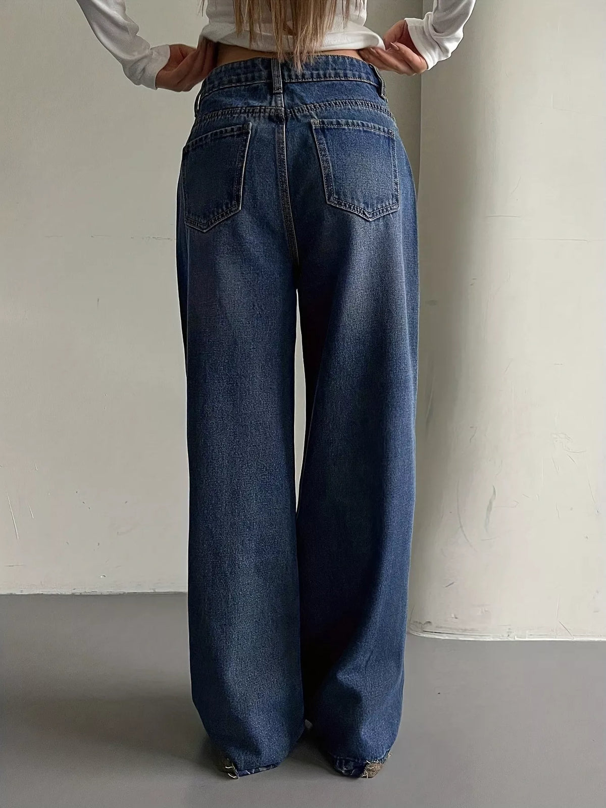 Full length styling of blue vintage wash jeans