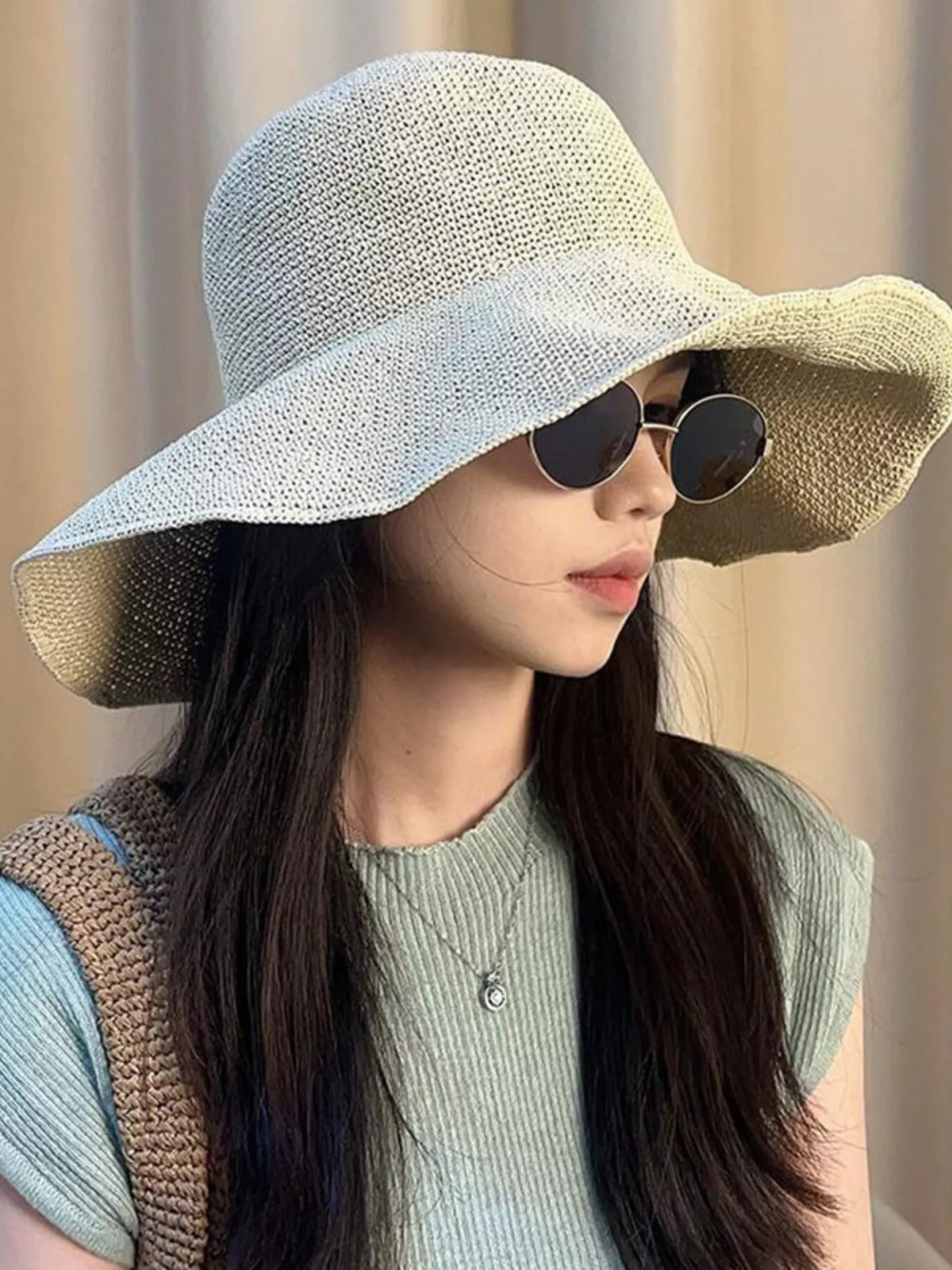 Wide brim sun hat worn with a summer outfit
