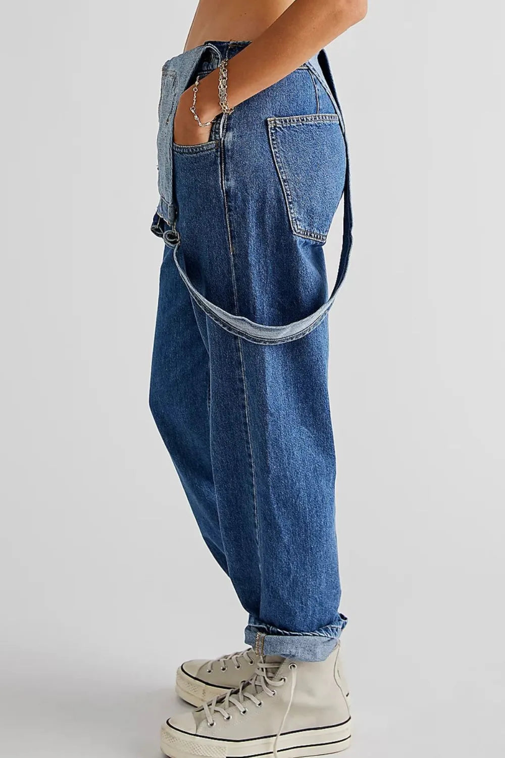 Long denim overalls back view