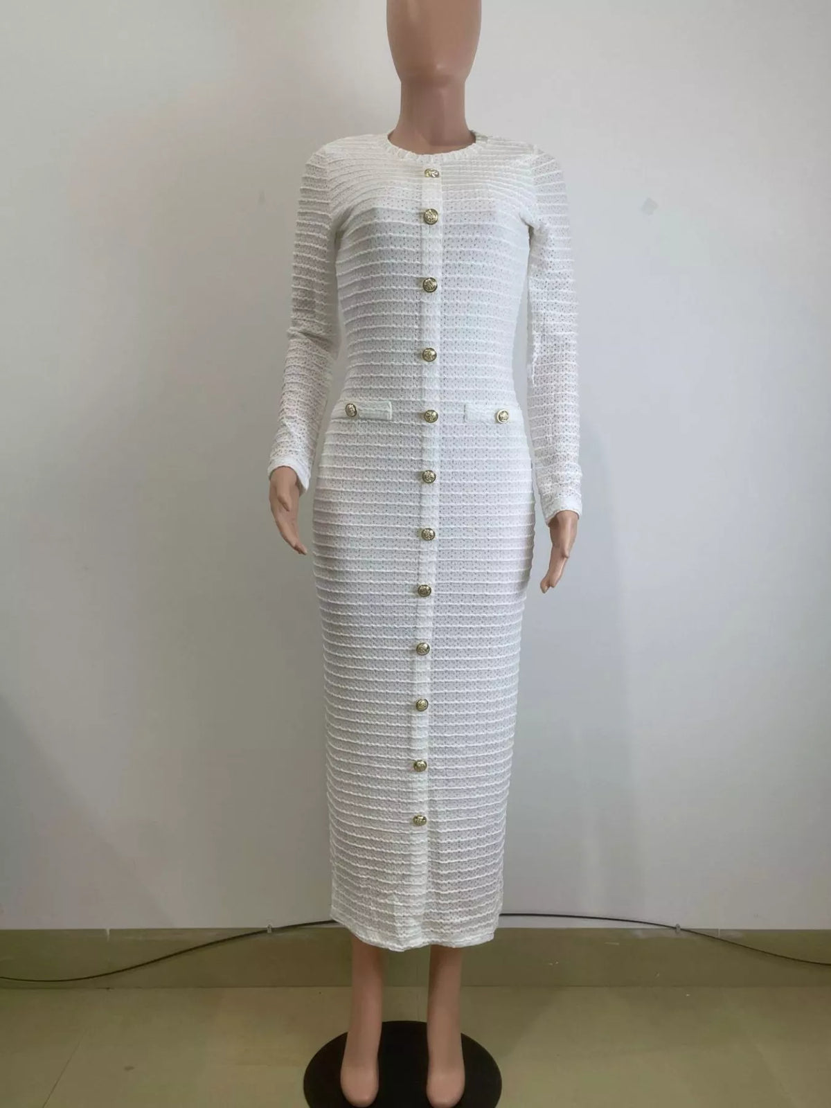 White textured long dress styled on model, side angle