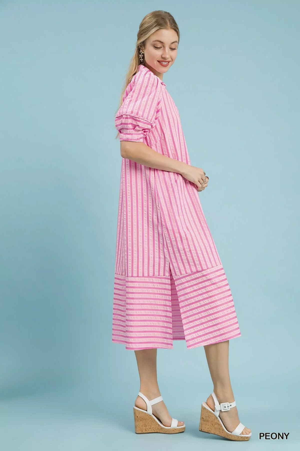 Umgee striped midi dress with puff sleeves angled view on model