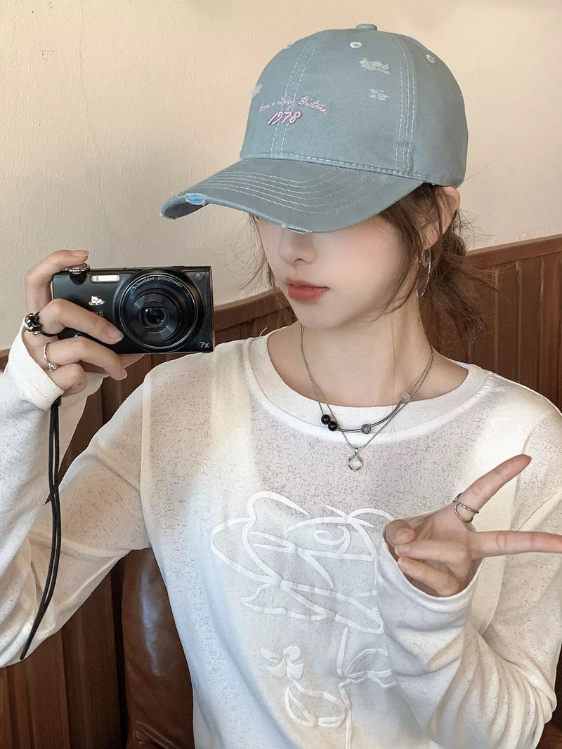 Light blue embroidered distressed baseball cap front view