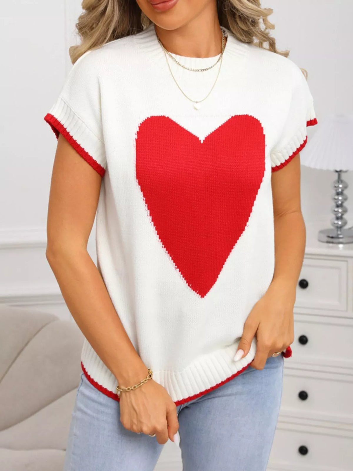 White heart graphic sweater on model