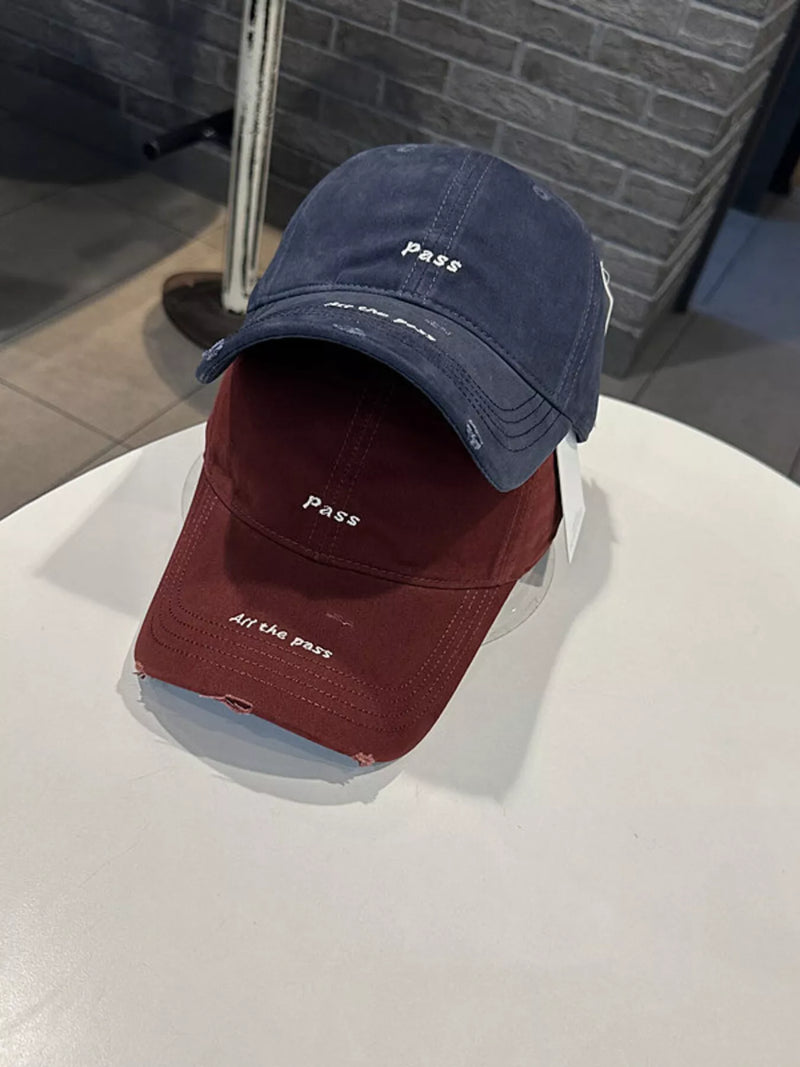 Monarch Millinery distressed baseball caps in navy blue and wine red