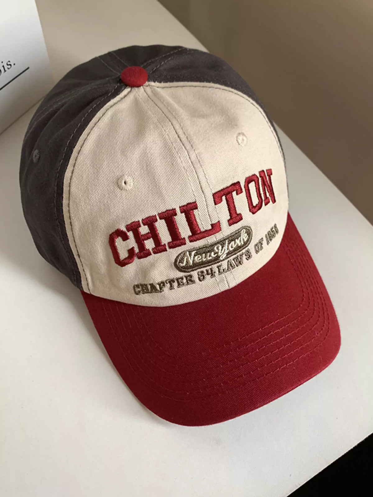 Close view of the embroidery on the front panel of the cap