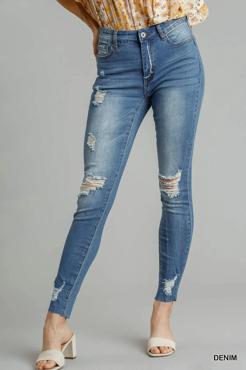 Distressed raw hem skinny jeans front view