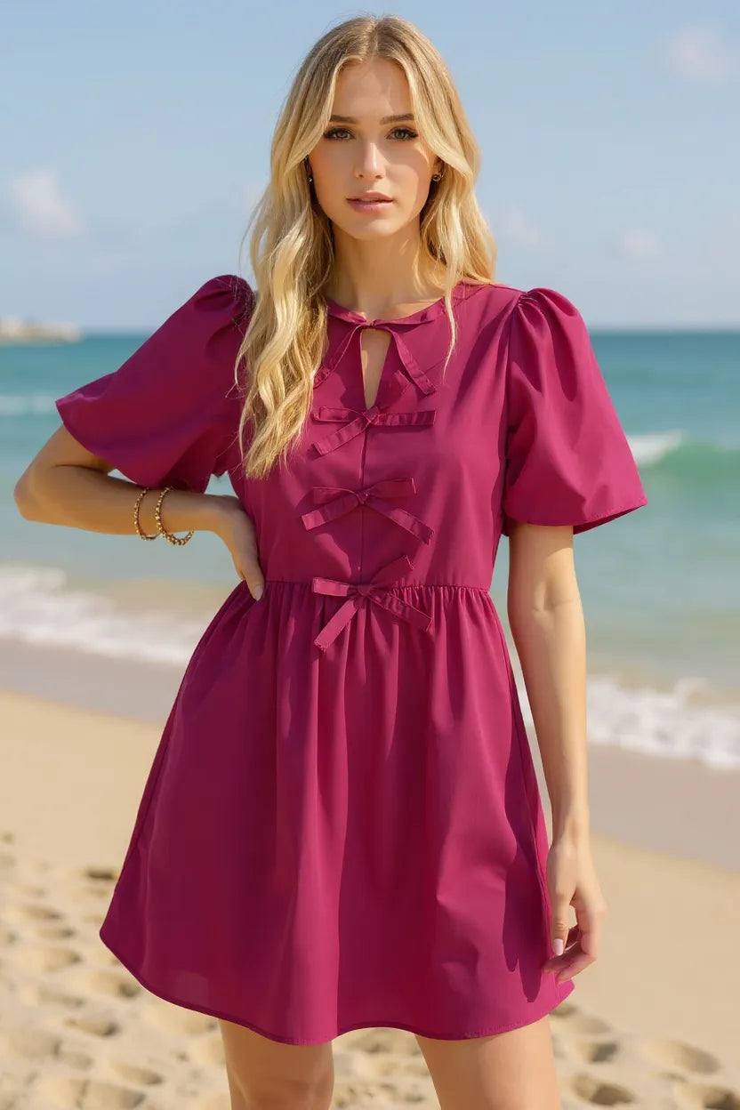 Pink mini dress bow accent detail