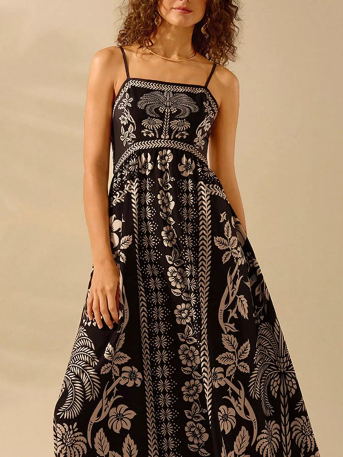 Close up of the floral print on black woven fabric