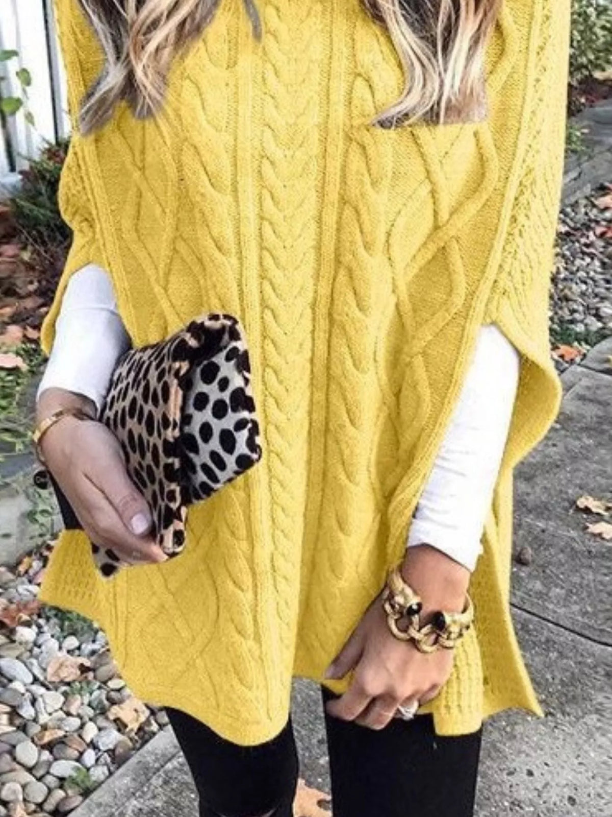 Chunky cable knit turtleneck poncho flat lay view