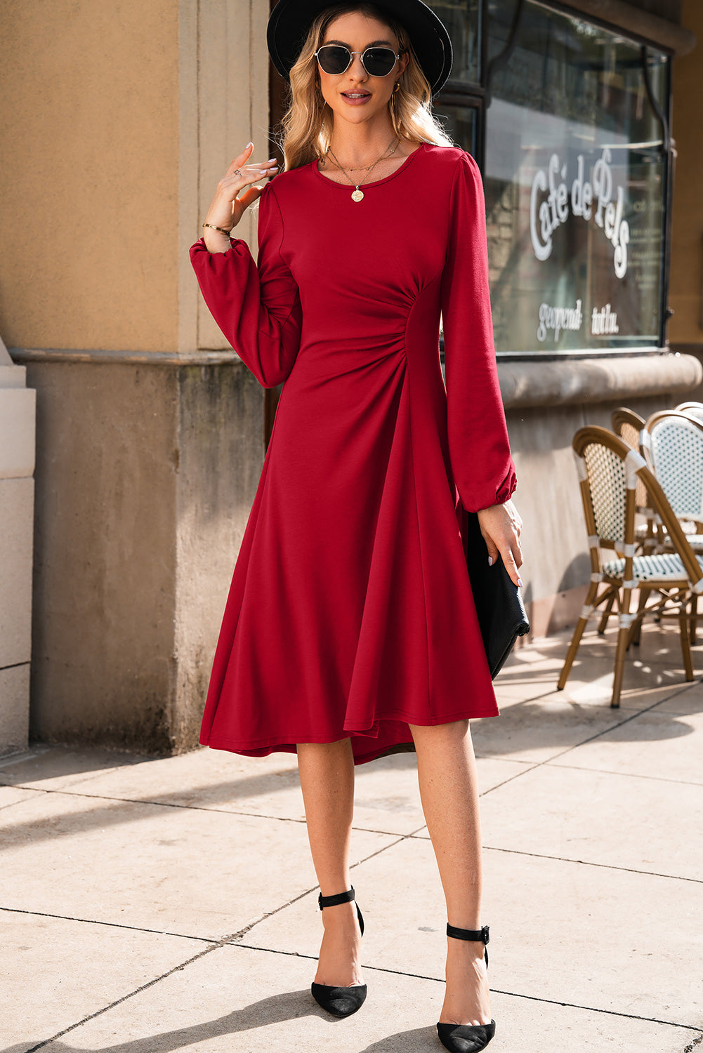 Long sleeve detail of elegant red bodycon midi dress