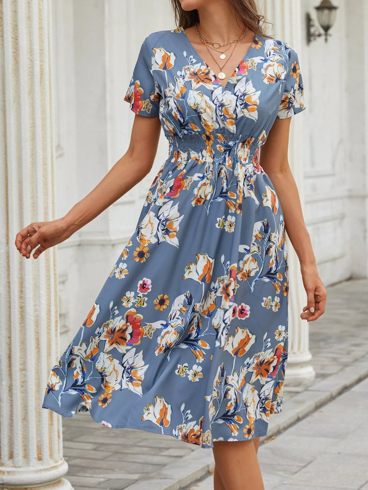 Printed short sleeve smocked midi dress detail view