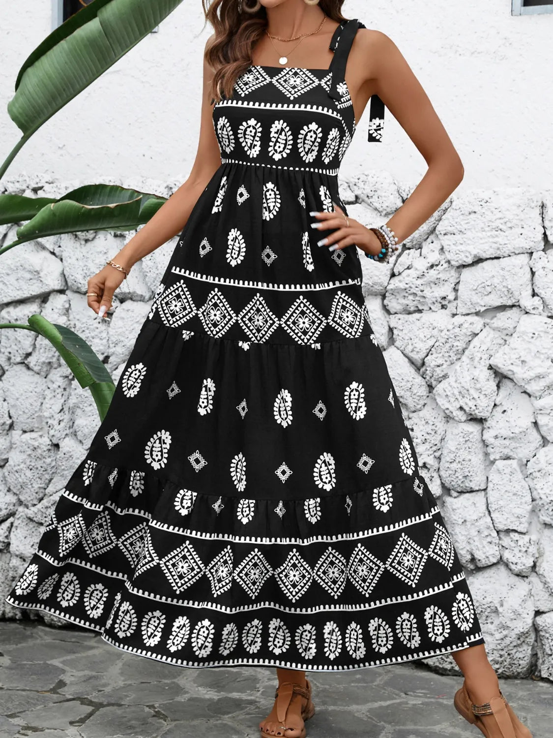 Side view of black ruched cami maxi dress