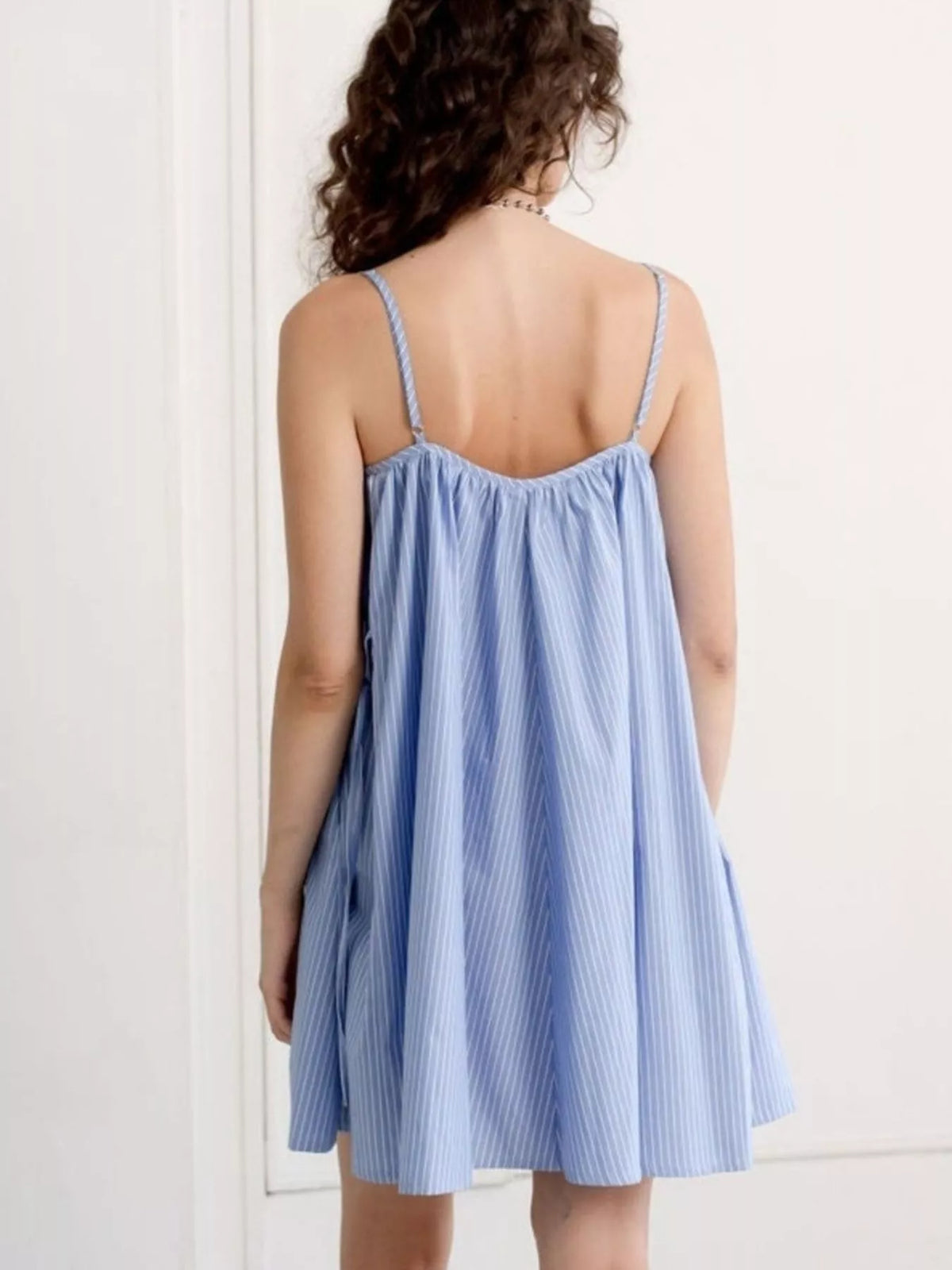 Back view of the spaghetti strap polka dot dress