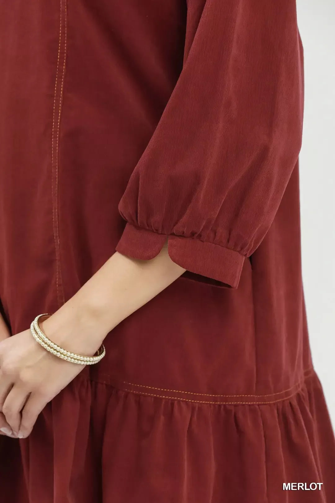 Merlot corduroy dress styled with ankle boots