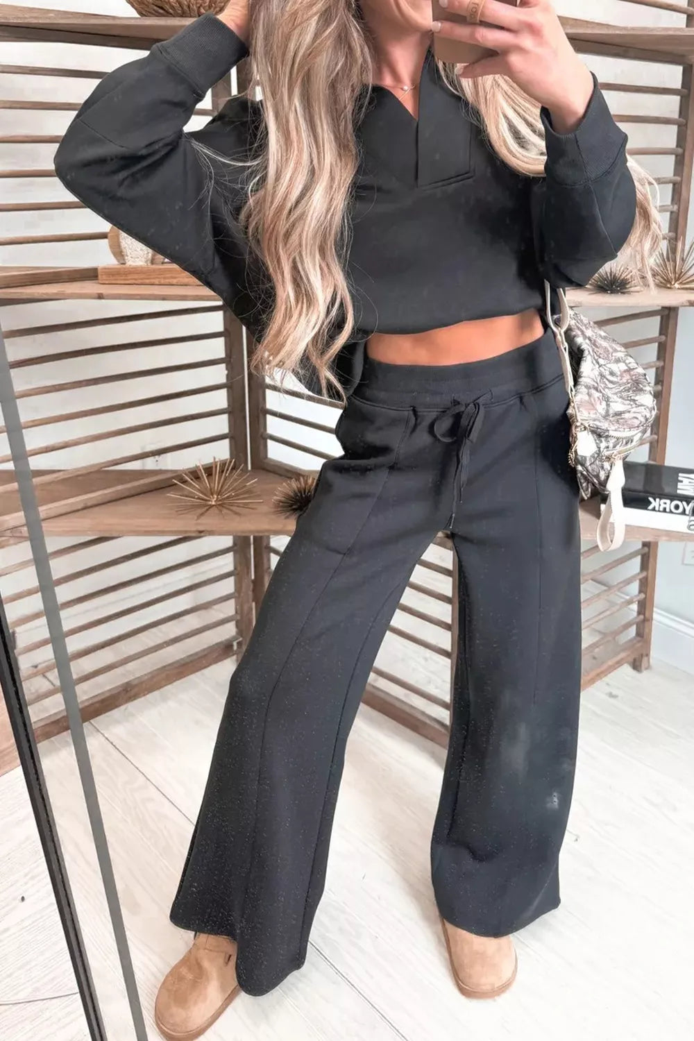Black coordinated pullover and sweatpants lounge set styled