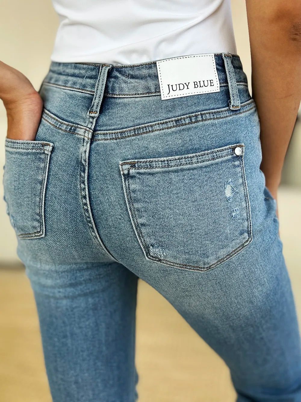 Judy Blue Mid Rise Destroyed Hem Distressed Jeans on model