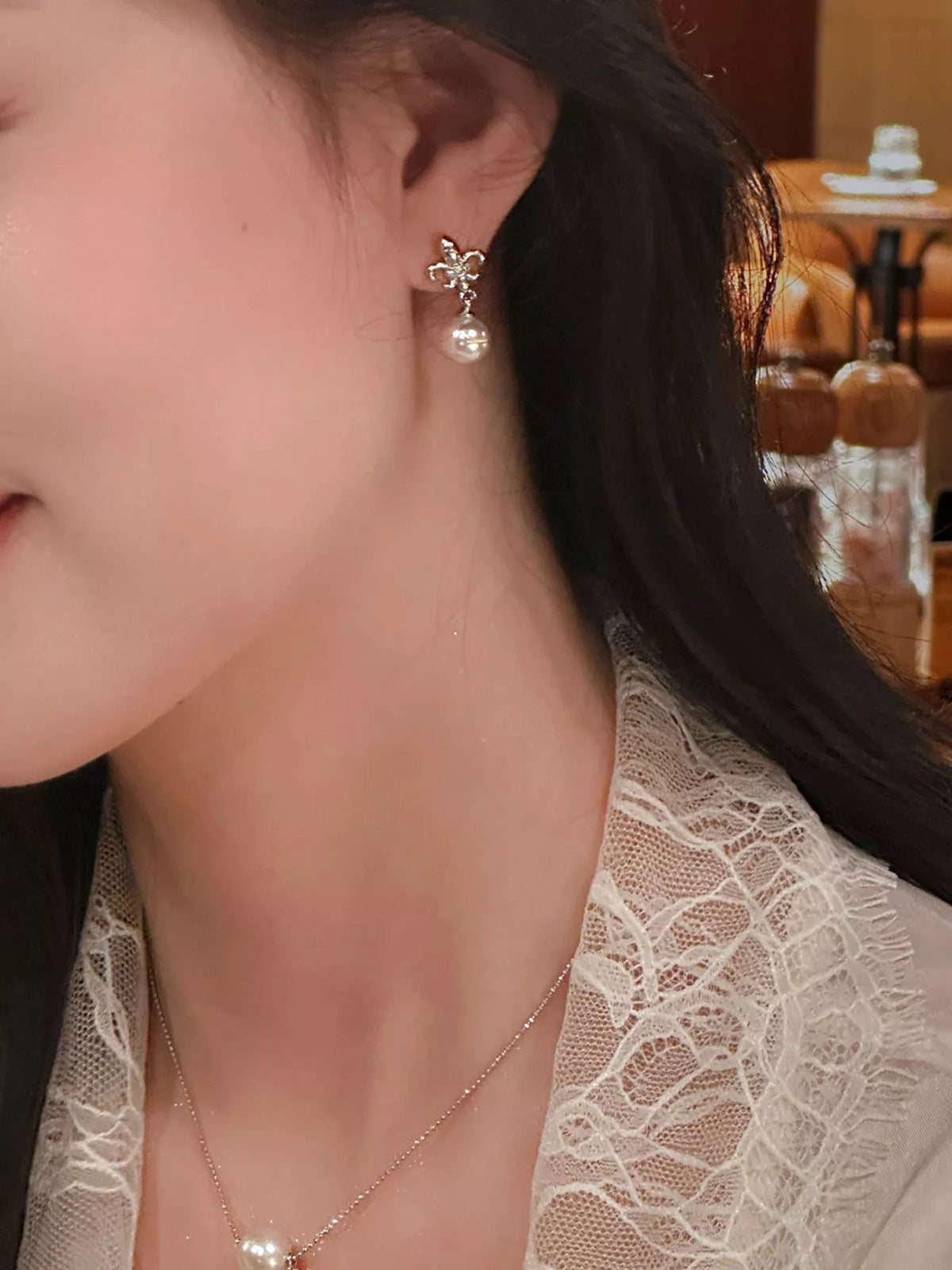 Pearl drop earrings front view