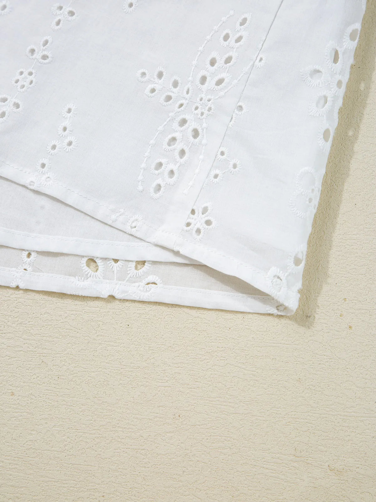 White eyelet blouse neckline detail
