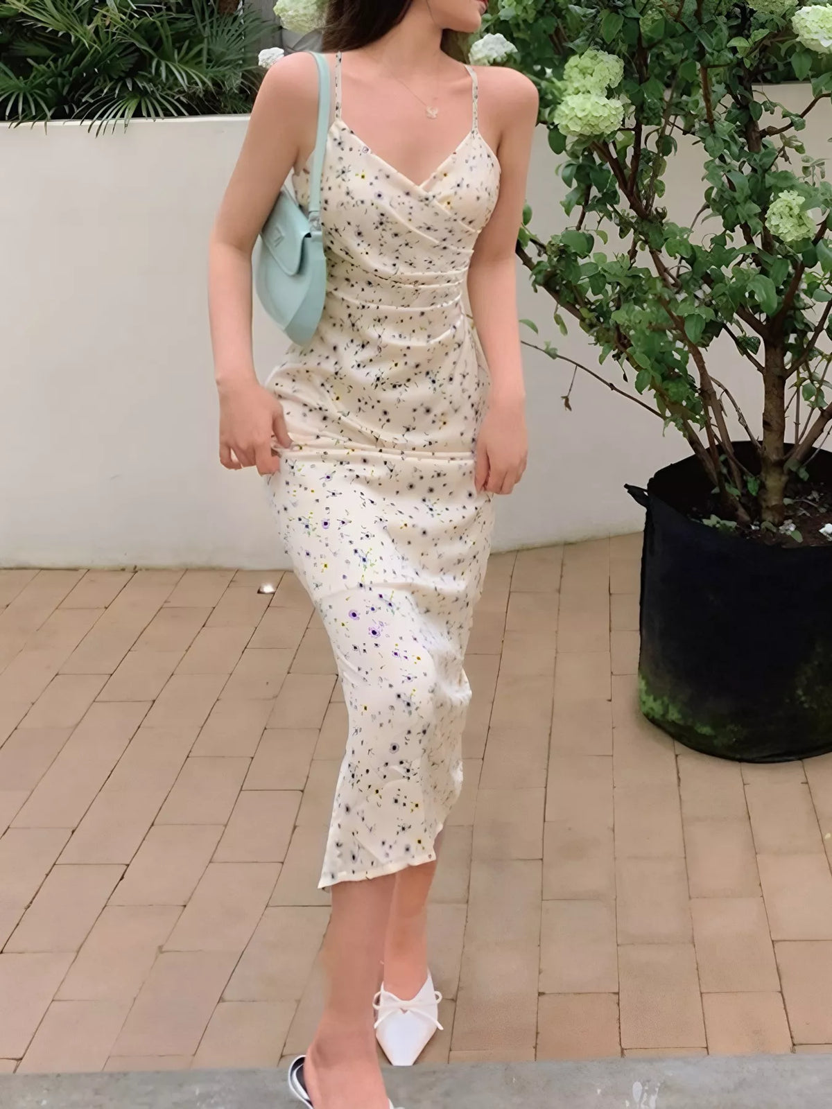 Beige floral spaghetti strap midi dress back view
