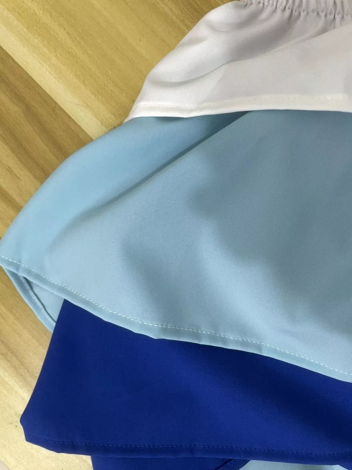 Matching blue ruffle crop top and pants set back view