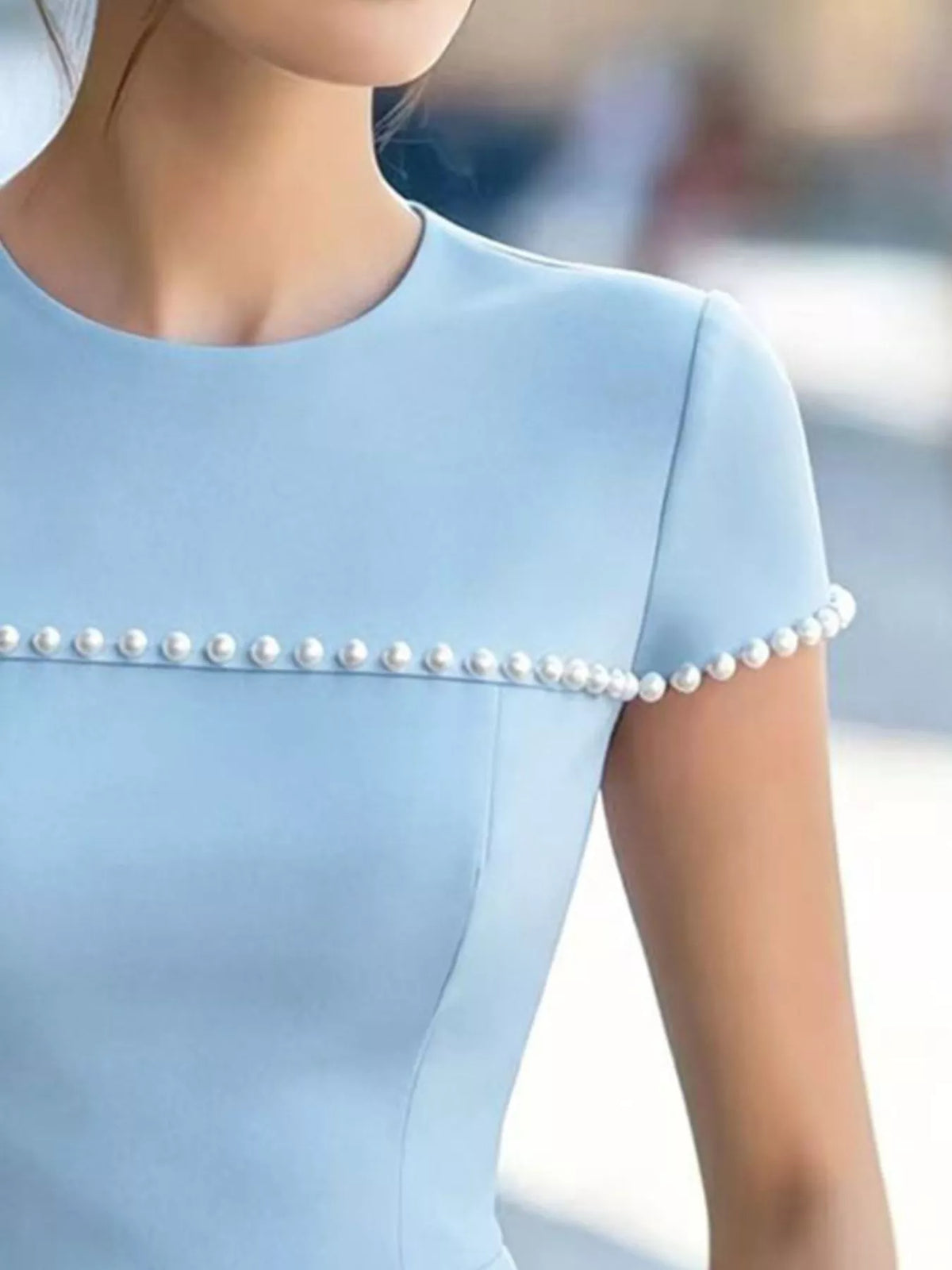 Peplum tee shown in a soft pink colorway